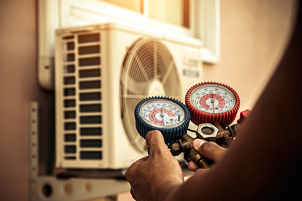 Professional Air Conditioning Service technician working in Martinsburg, OH